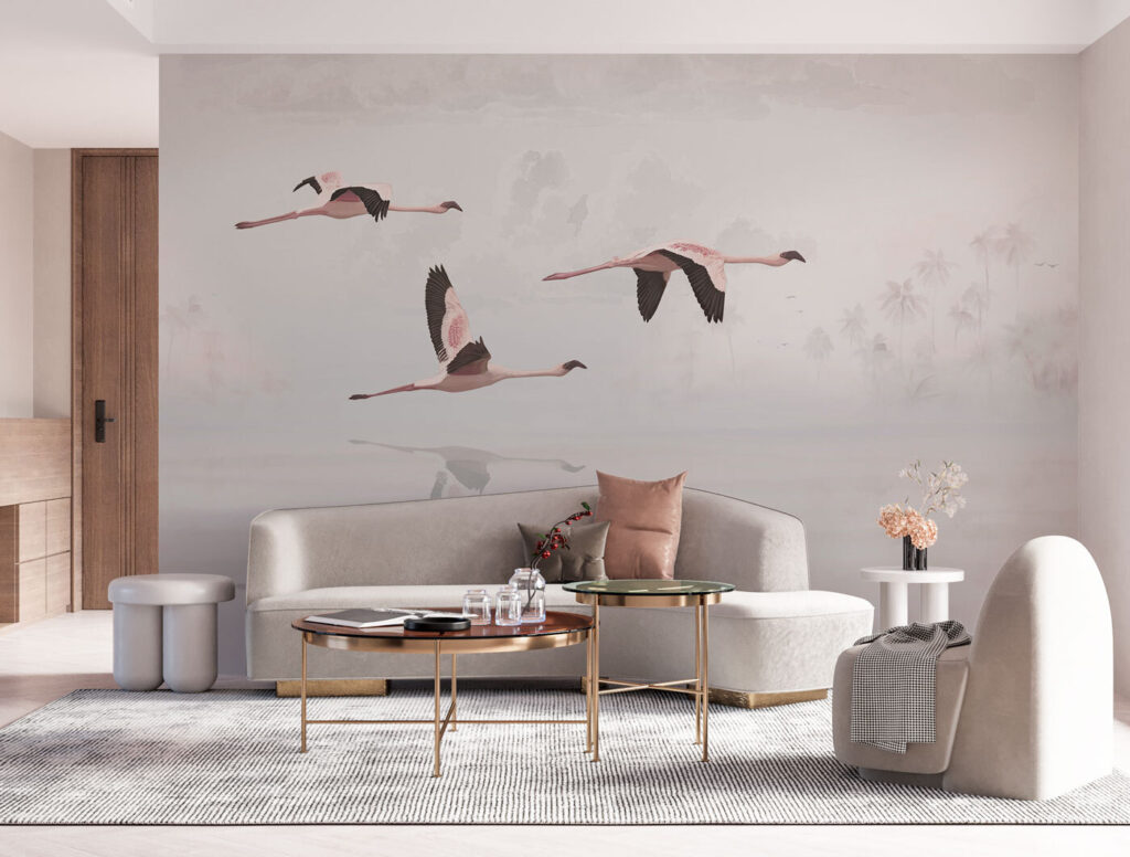 A group of flamingos flying over water A group of flamingos flying over water