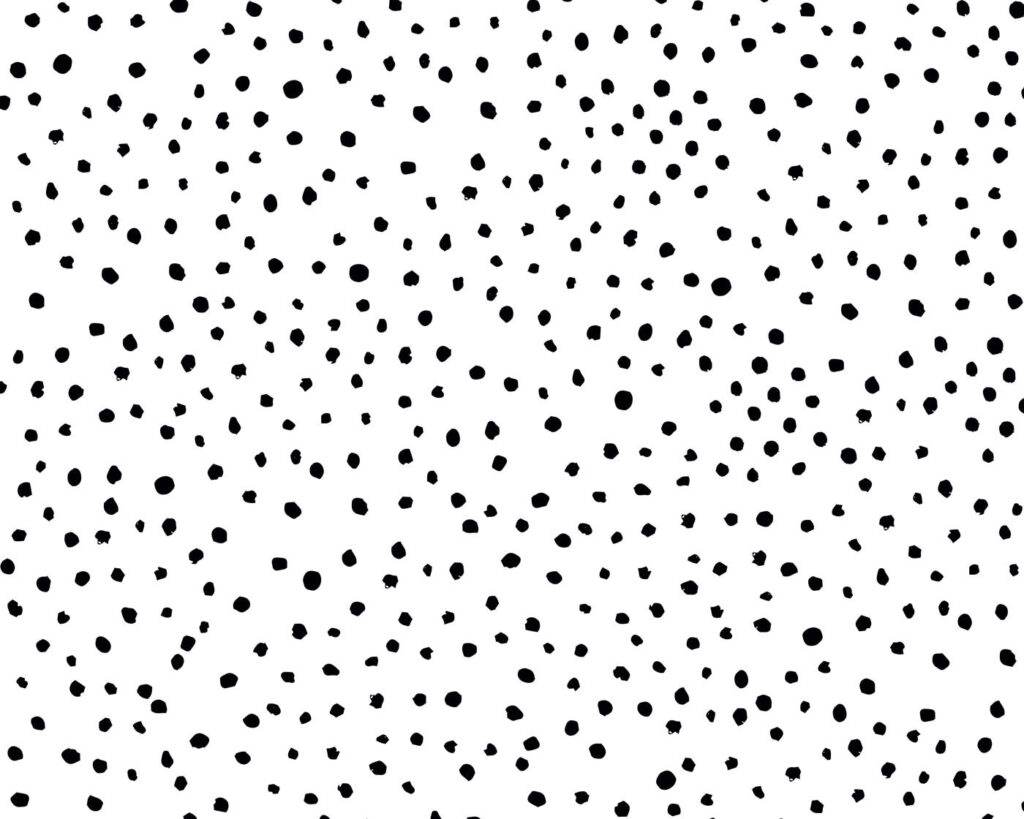 Un fondo blanco y negro con pequeños puntos negros Un fondo blanco y negro con pequeños puntos negros