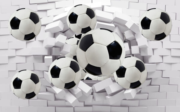 Grupo de balones de fútbol volando sobre un muro Grupo de balones de fútbol volando sobre un muro