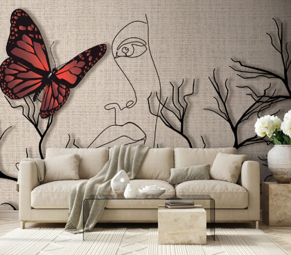 Una mariposa y el dibujo de la cara de una mujer Una mariposa y el dibujo de la cara de una mujer