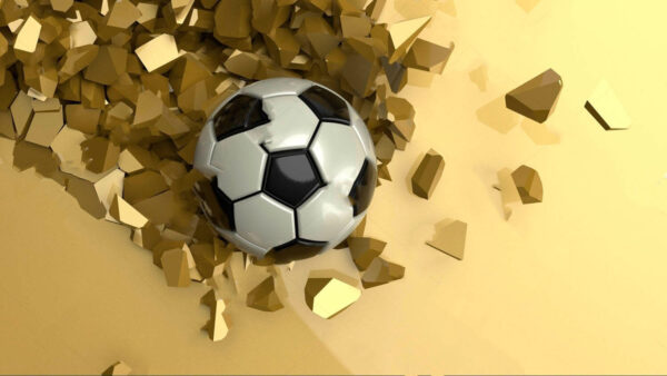 Balón de fútbol en un montón de trozos rotos Balón de fútbol en un montón de trozos rotos