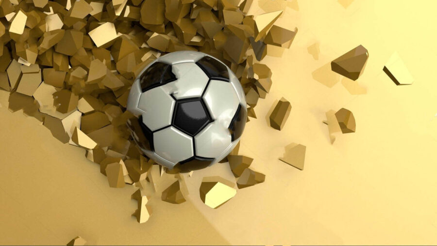 Balón de fútbol en un montón de trozos rotos
