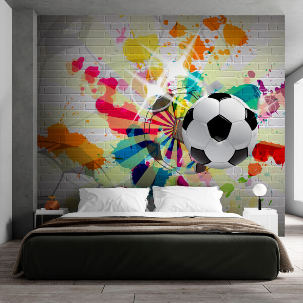 Balón de fútbol en una pared de ladrillos Balón de fútbol en una pared de ladrillos