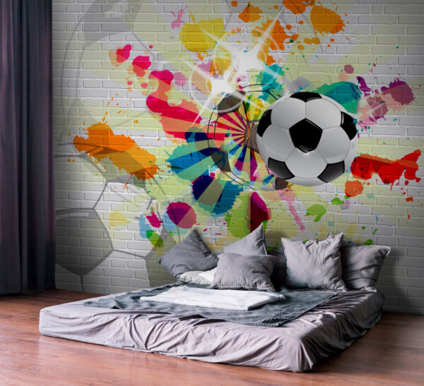 Balón de fútbol en una pared de ladrillos Balón de fútbol en una pared de ladrillos