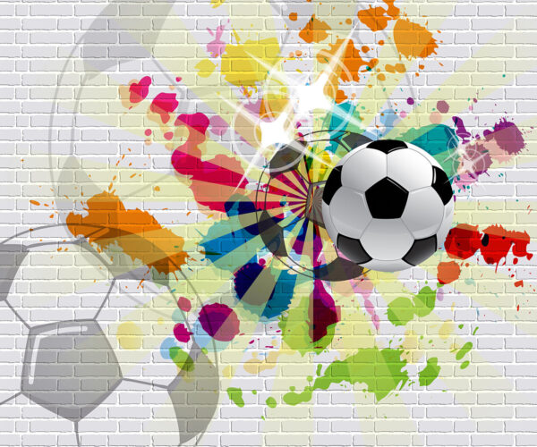 Balón de fútbol en una pared de ladrillos Balón de fútbol en una pared de ladrillos