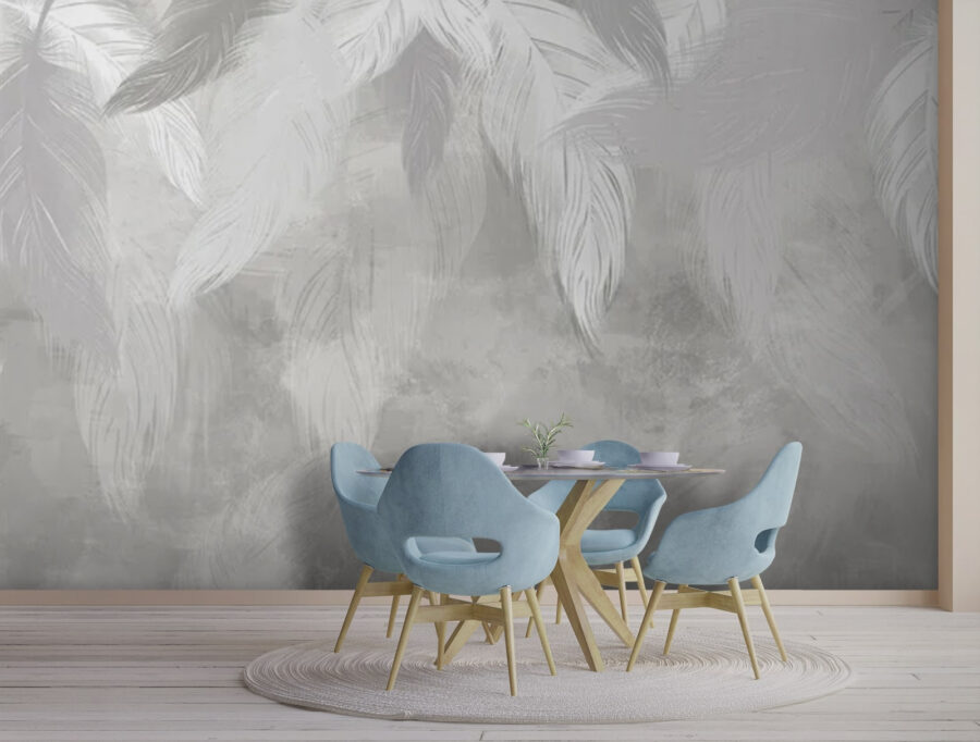Pluma blanca sobre una superficie gris