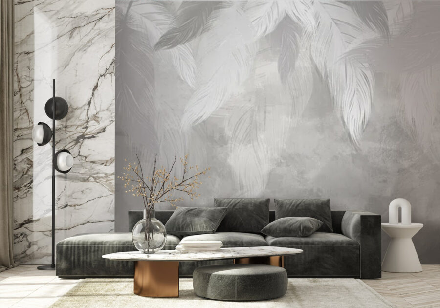 Pluma blanca sobre una superficie gris