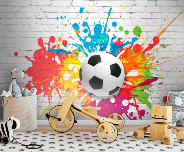 Balón de fútbol en una pared de ladrillos Balón de fútbol en una pared de ladrillos