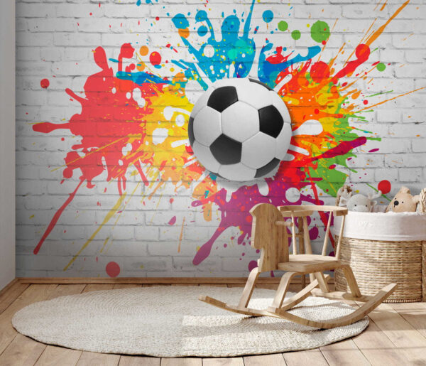 Balón de fútbol en una pared de ladrillos Balón de fútbol en una pared de ladrillos