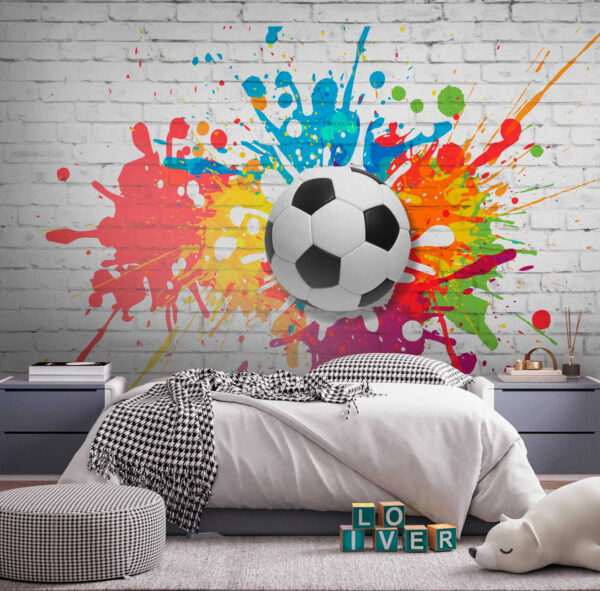 Balón de fútbol en una pared de ladrillos Balón de fútbol en una pared de ladrillos