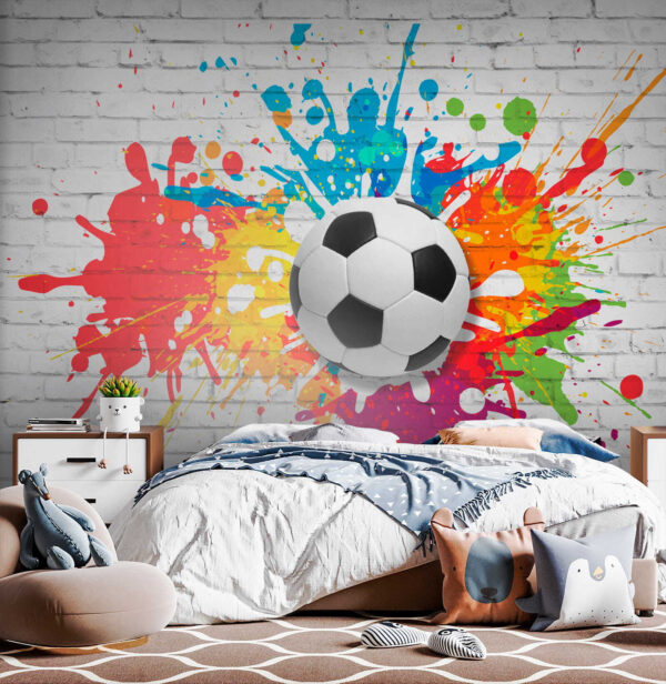 Balón de fútbol en una pared de ladrillos Balón de fútbol en una pared de ladrillos