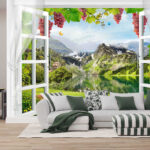 Fotomurales Ventana con vistas a un lago y a las montañas