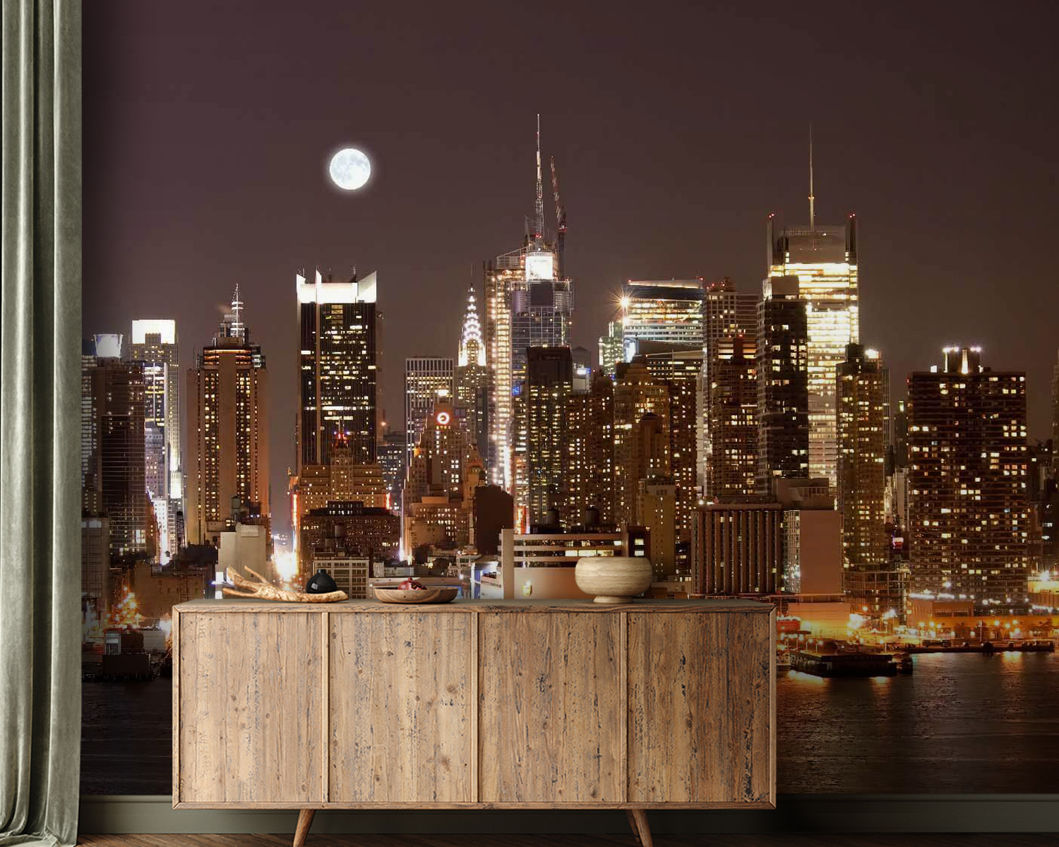 City skyline at night with the moon in the sky