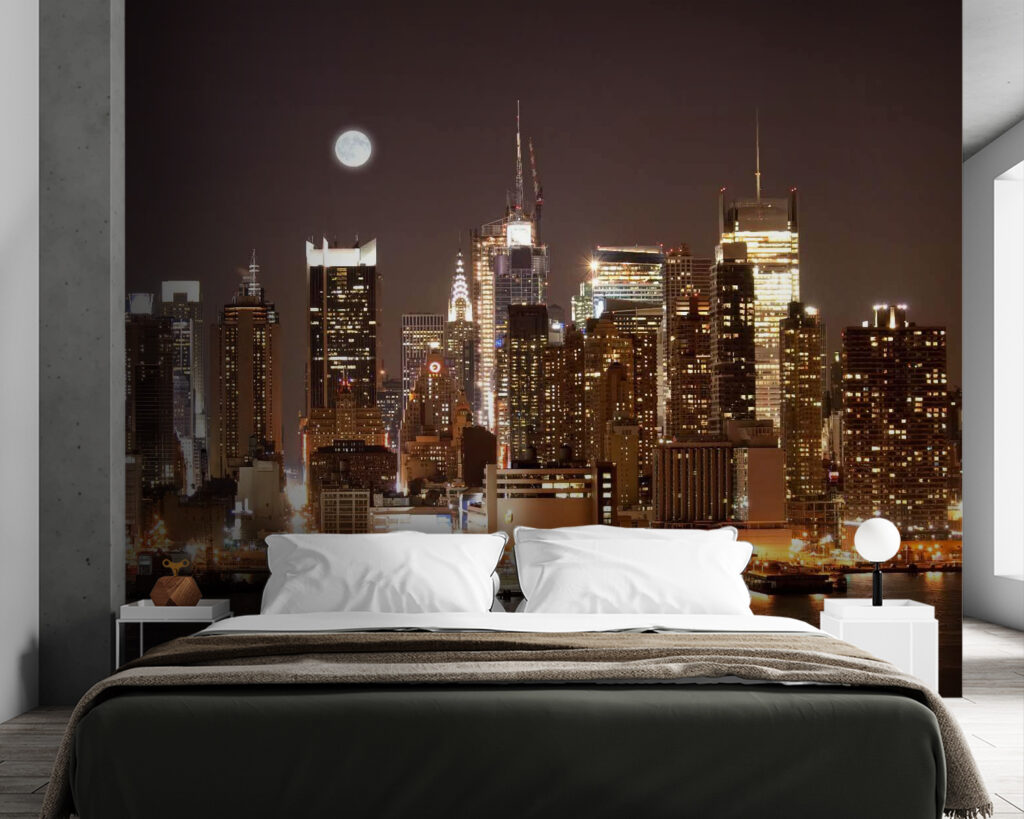 City skyline at night with the moon in the sky