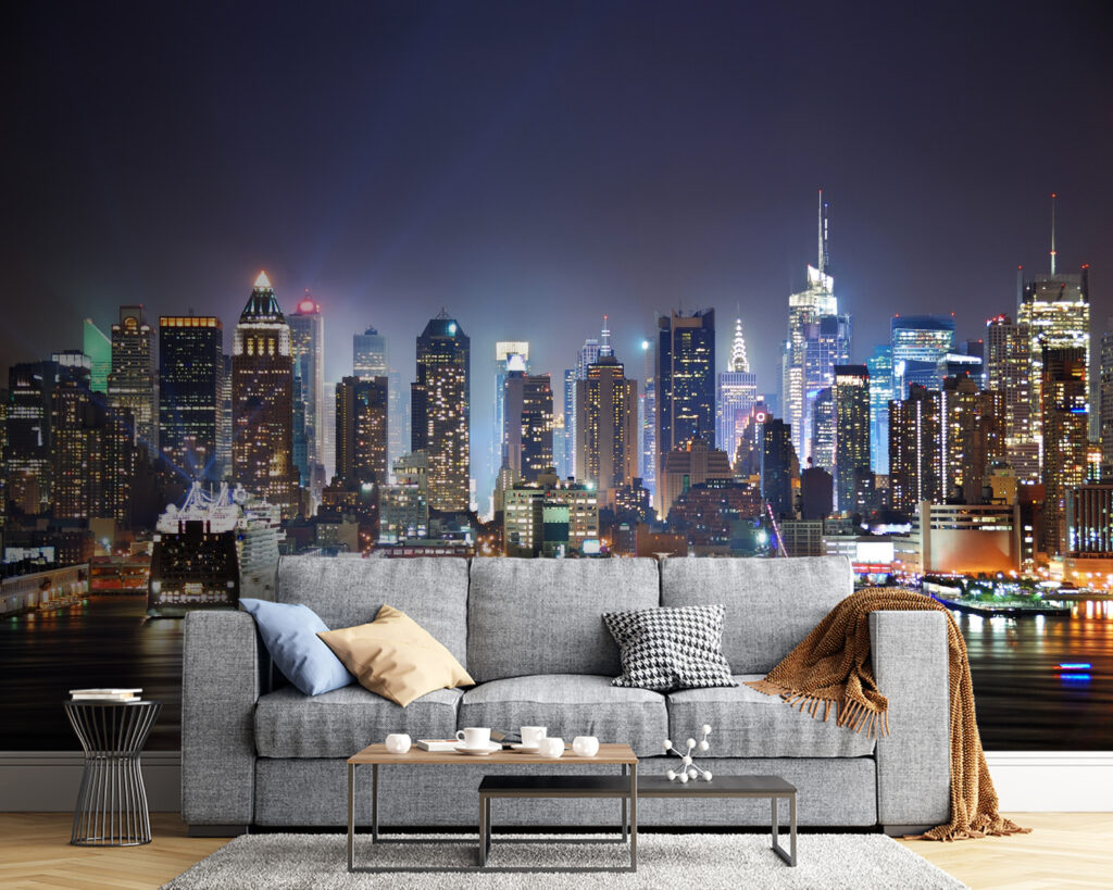 City skyline at night with lights reflecting on water City skyline at night with lights reflecting on water