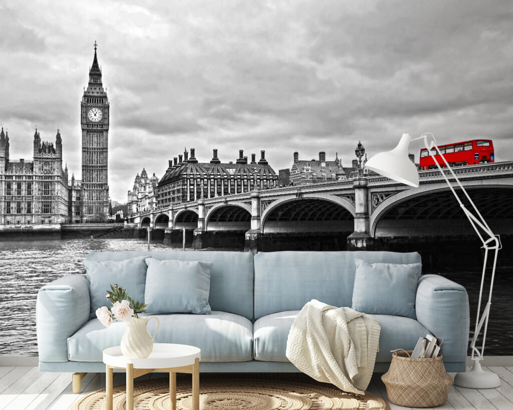 Bridge over water with a clock tower and a red bus