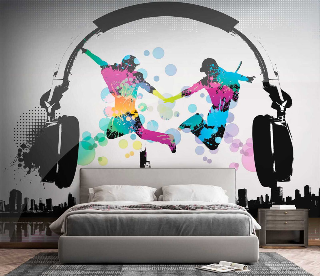 Couple of people jumping in the air with headphones Couple of people jumping in the air with headphones