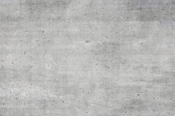 Superficie de hormigón gris con pequeñas motas Superficie de hormigón gris con pequeñas motas