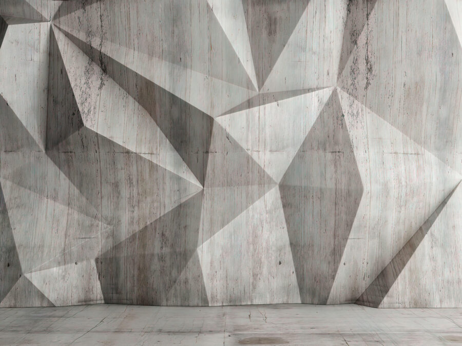 Un muro de hormigón con un patrón triangular