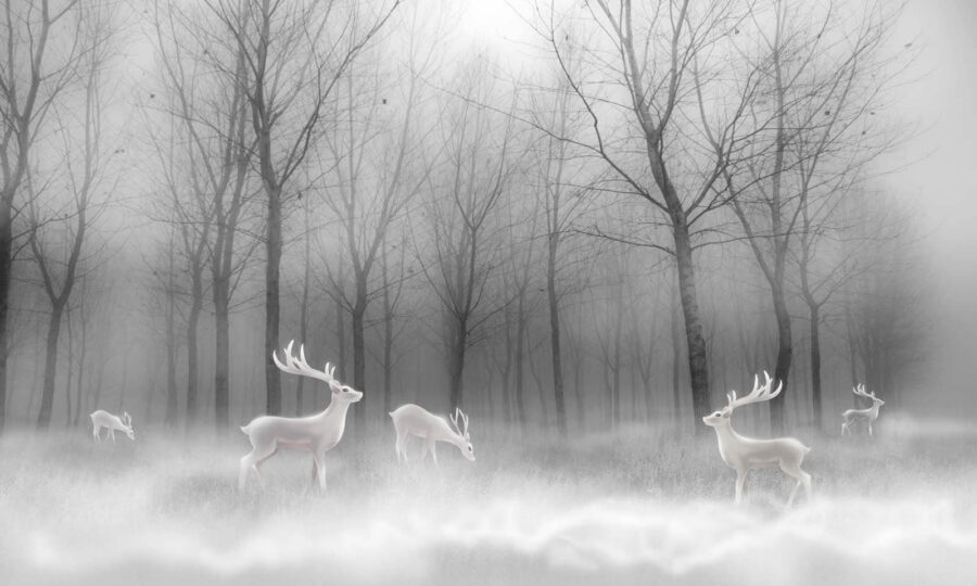 Grupo de ciervos blancos en un bosque con niebla