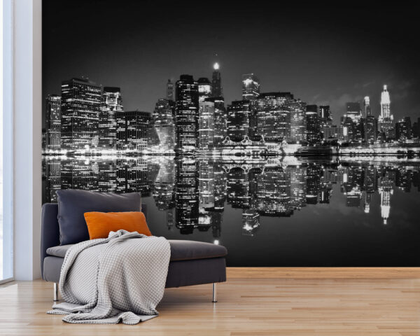 El horizonte de la ciudad de noche con luces reflejándose en el agua El horizonte de la ciudad de noche con luces reflejándose en el agua