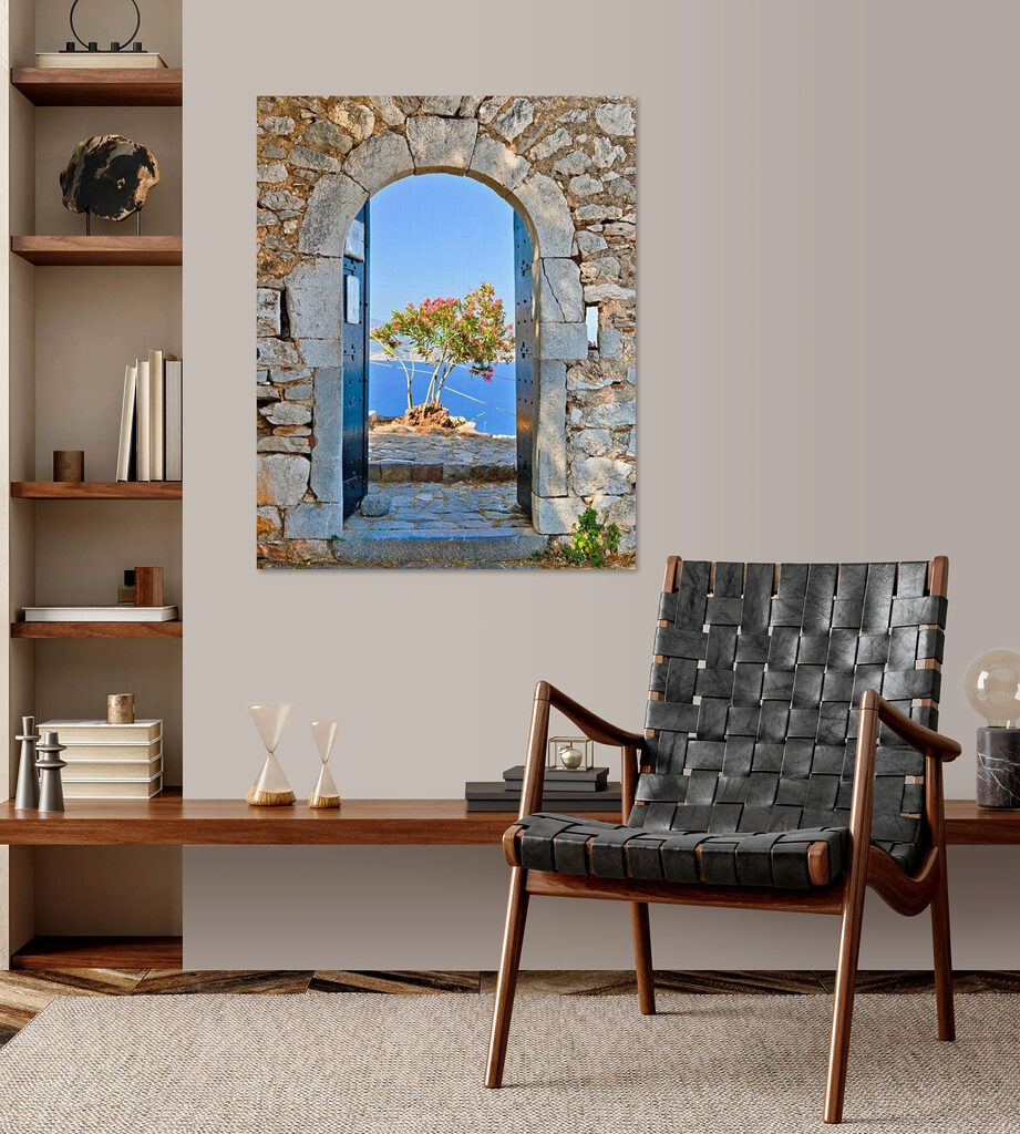 A stone arch with a tree in the background