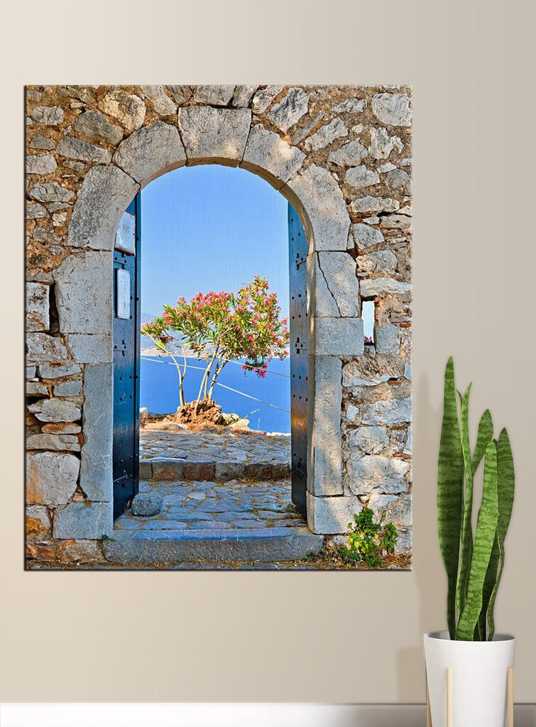 A stone arch with a tree in the background
