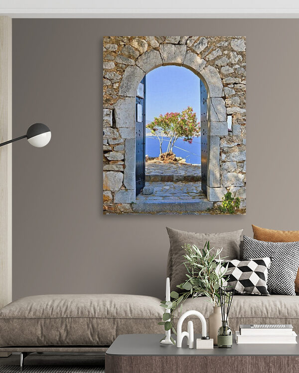 A stone arch with a tree in the background