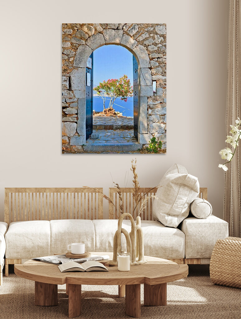 A stone arch with a tree in the background