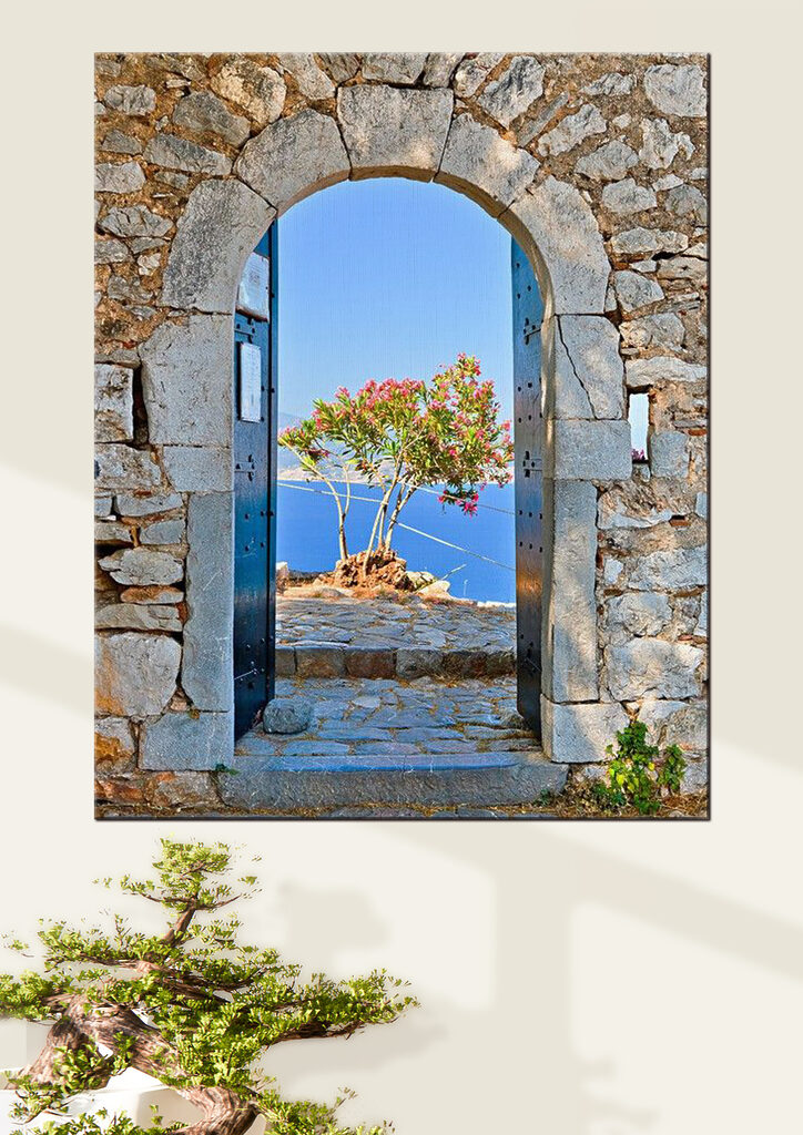 A stone arch with a tree in the background