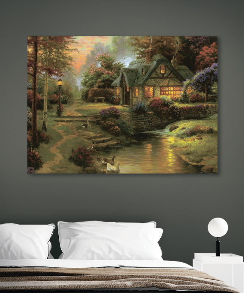 A painting of a cottage by a river