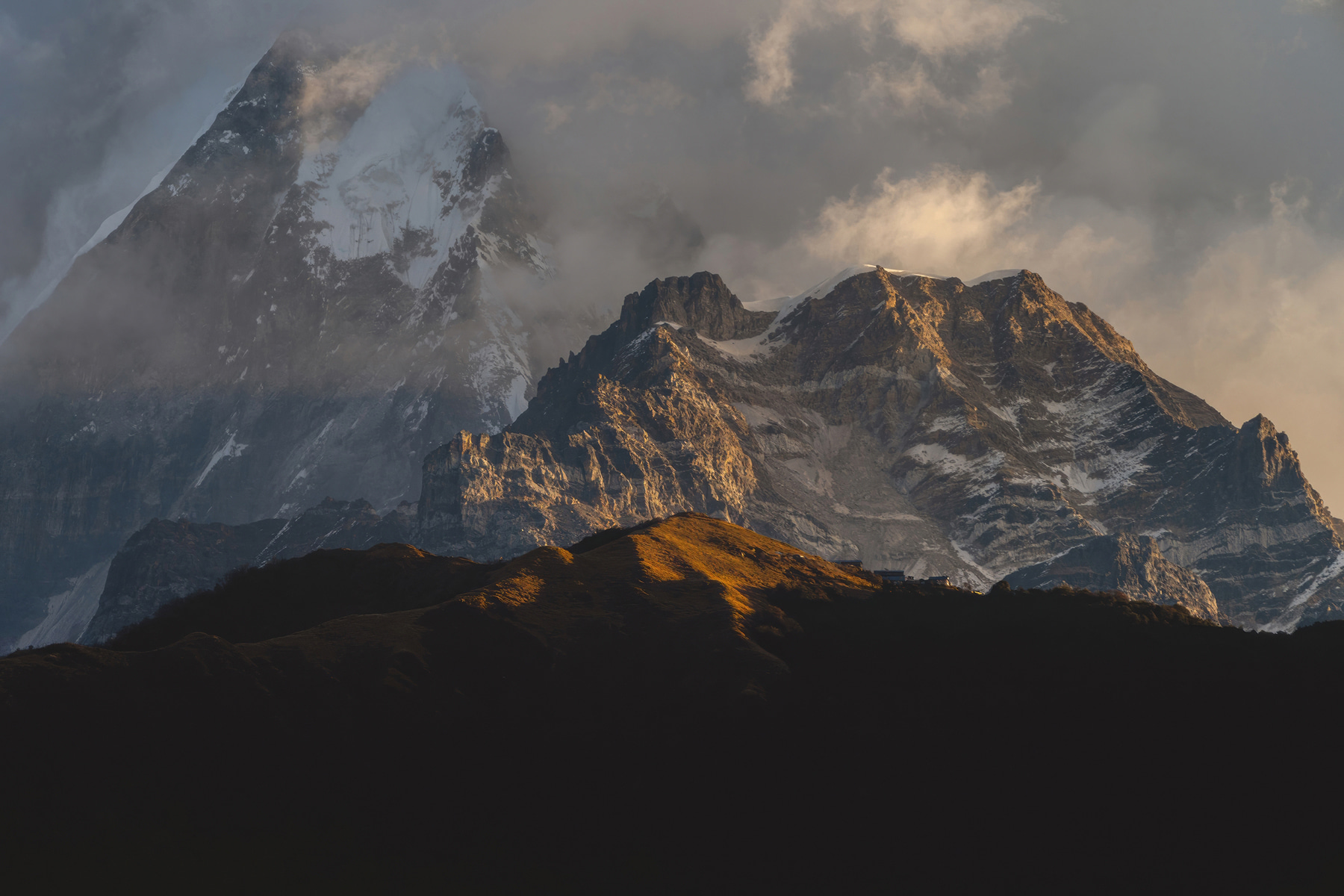 A mountain range with snow on top