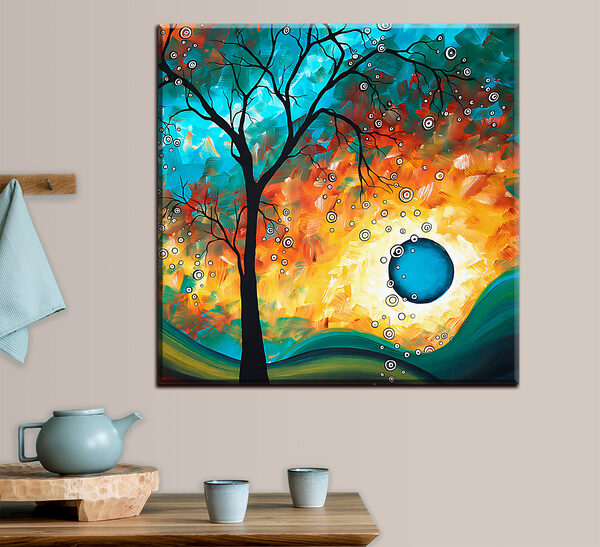 Cuadros Un cuadro en el que se ve un árbol y una puesta de sol