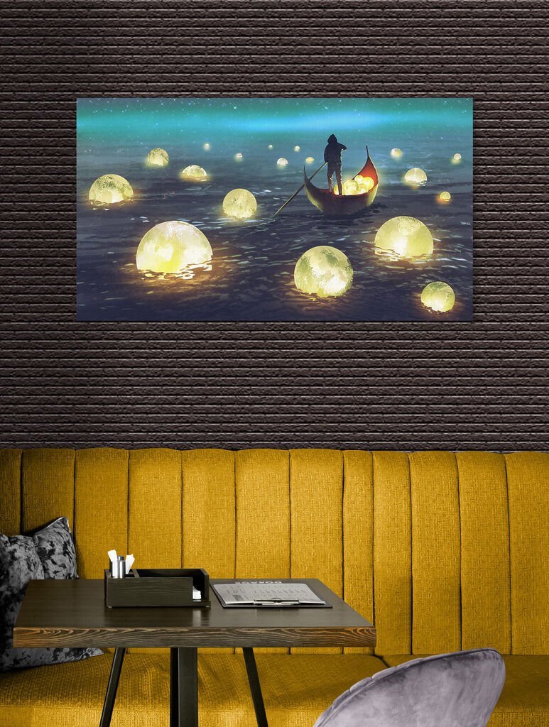 A person in a boat with glowing balls floating in the water A person in a boat with glowing balls floating in the water