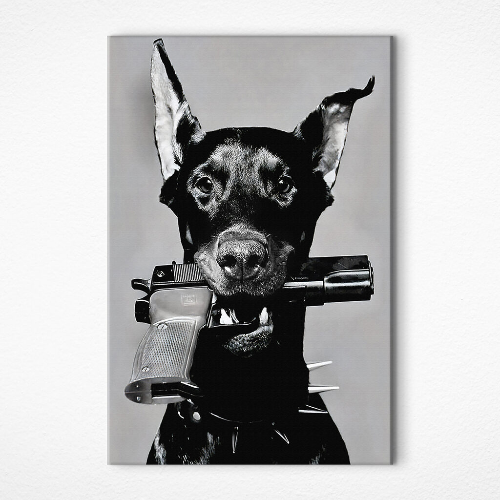 A dog holding a gun