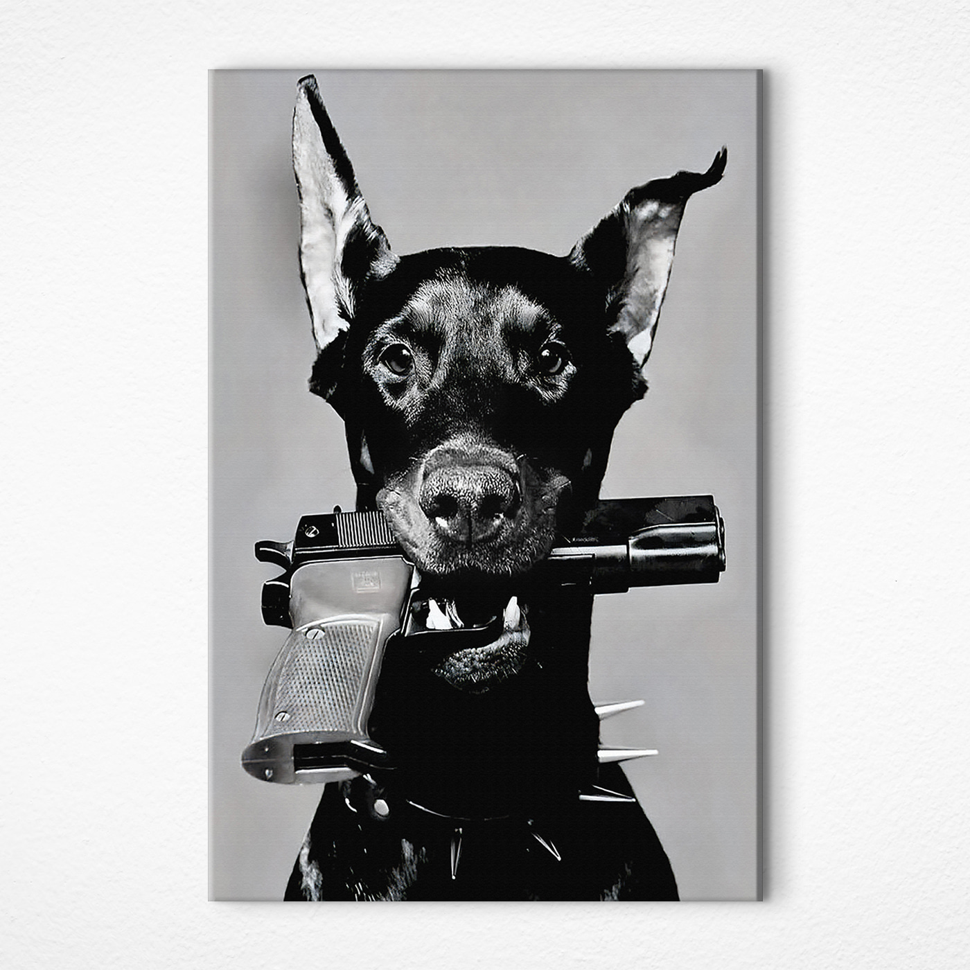 A dog holding a gun