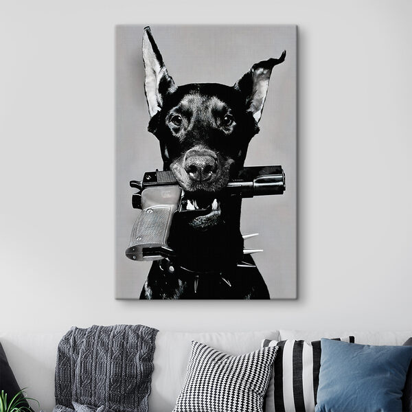 A dog holding a gun