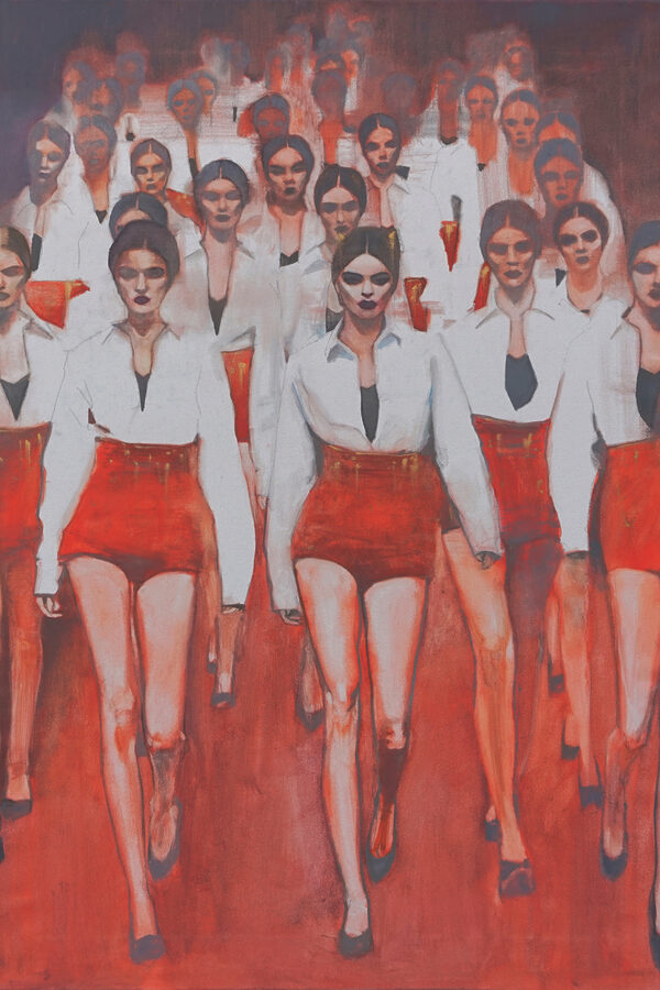A group of women walking in a row A group of women walking in a row