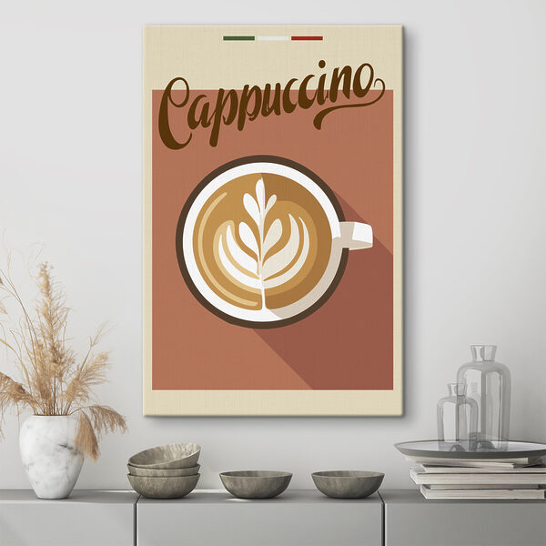 Cuadros Una taza de café con un dibujo de una hoja en la espuma