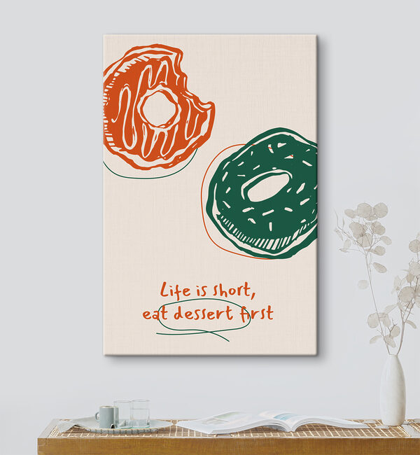 A drawing of donuts with green and orange icing
