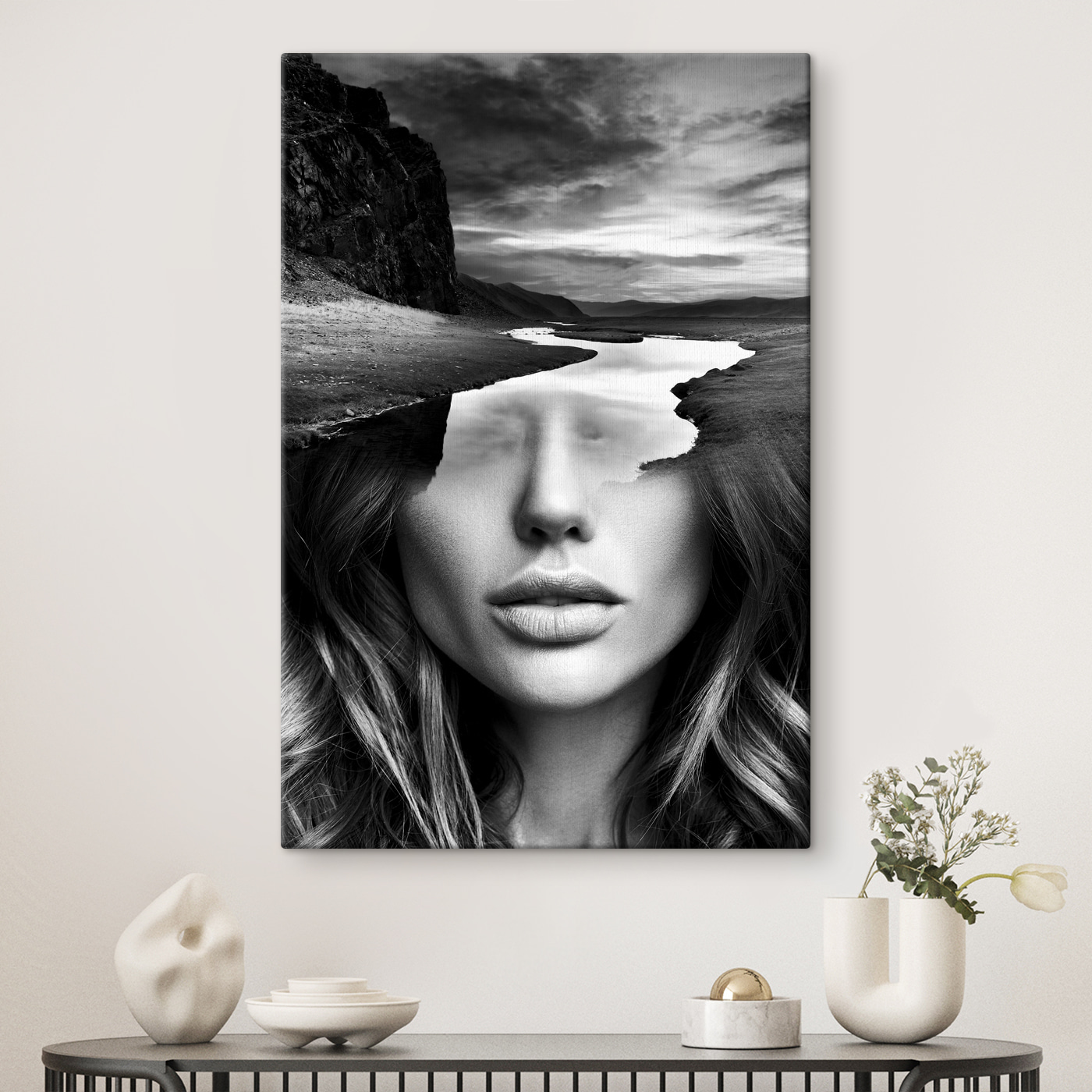 A woman's face with a river and mountains