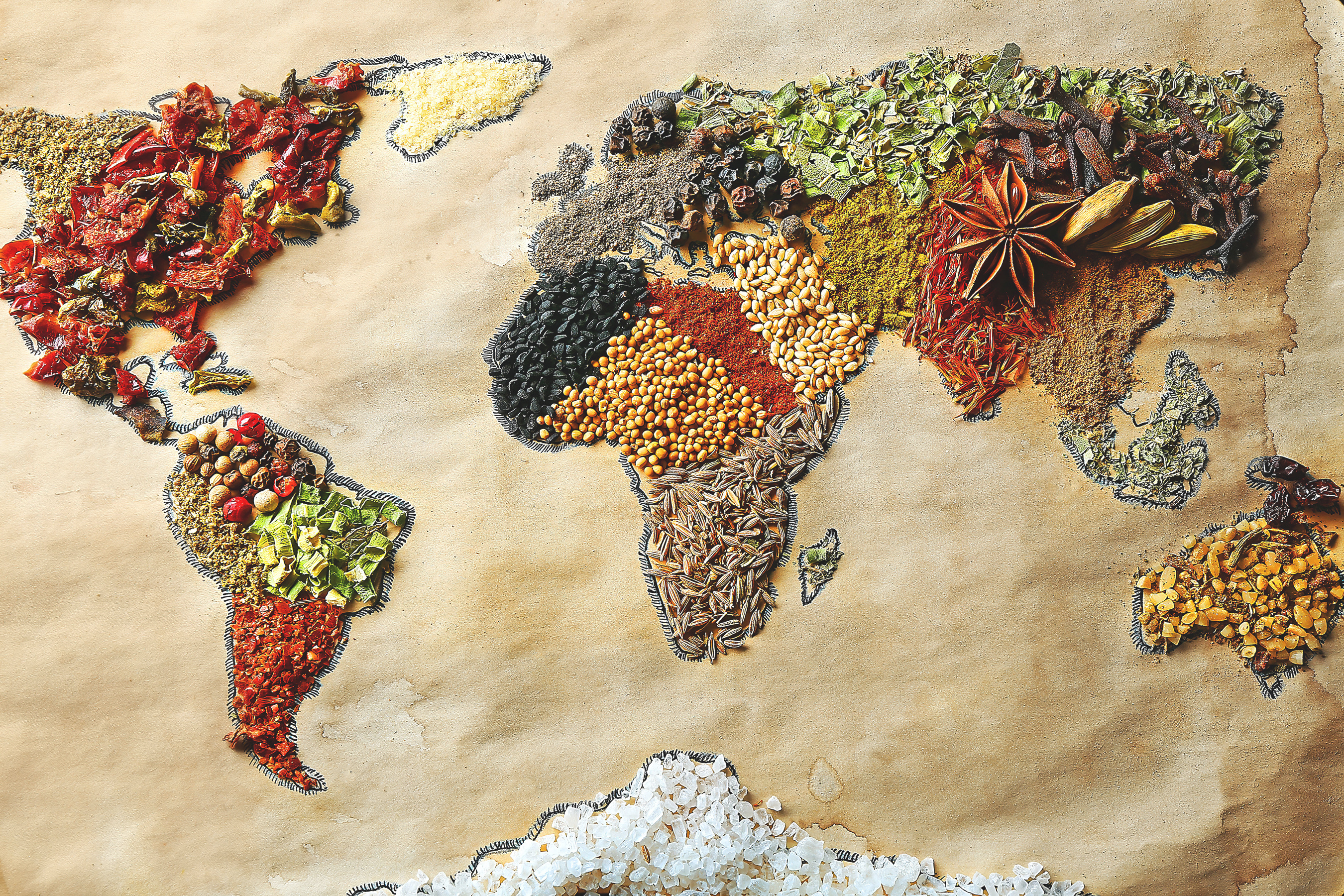 A map of the world made of different spices