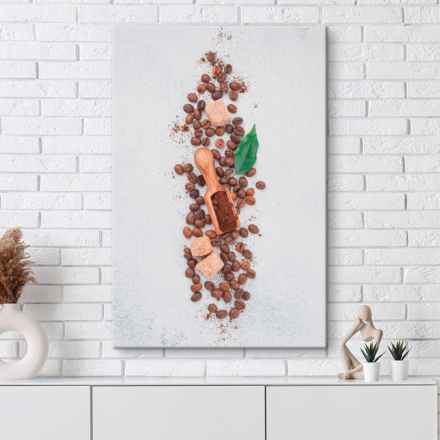 A spoon with coffee beans and sugar on top A spoon with coffee beans and sugar on top