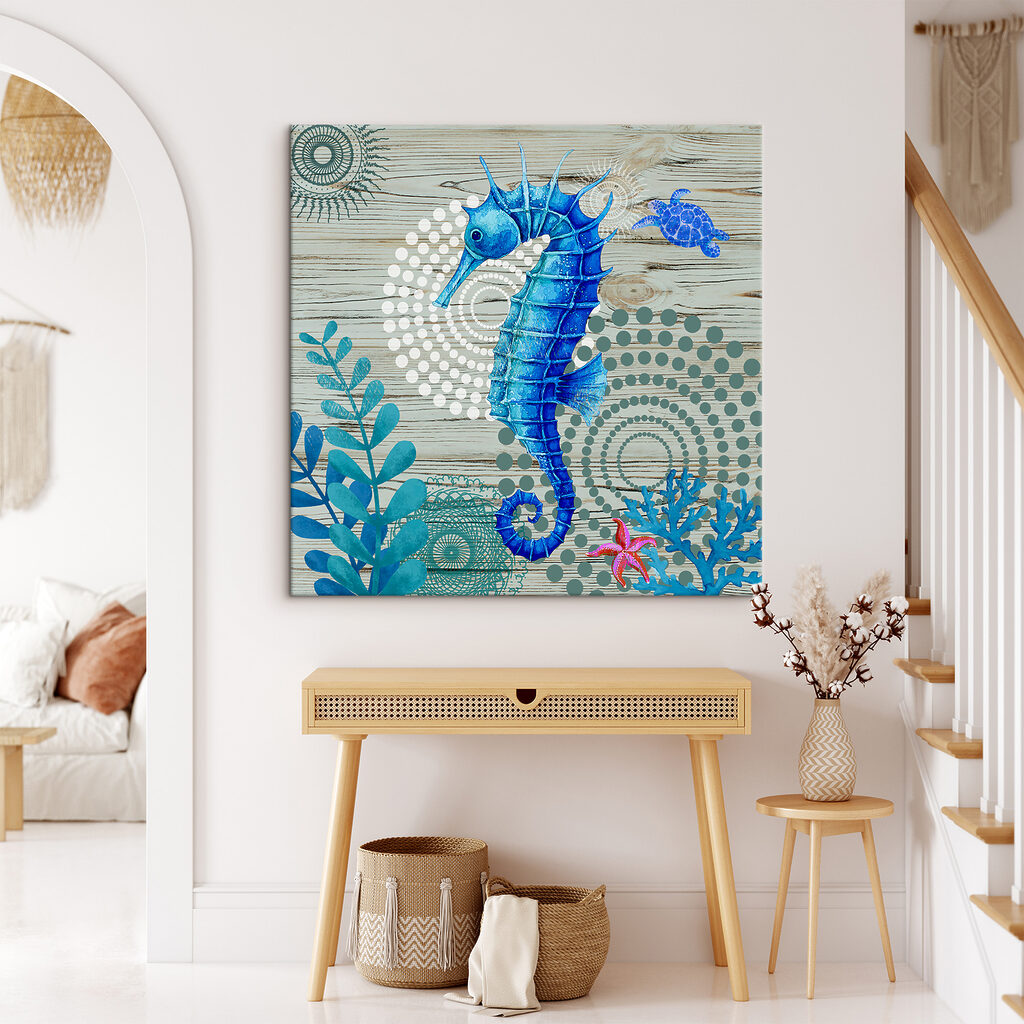 A blue seahorse and seaweed on a wood surface A blue seahorse and seaweed on a wood surface