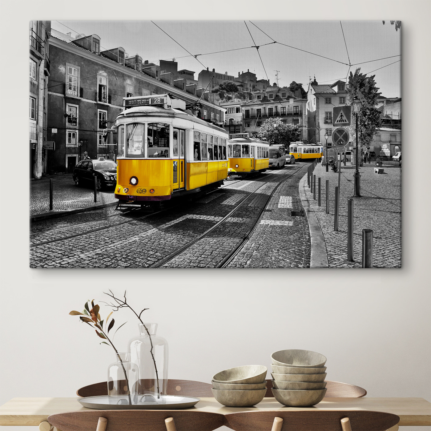A yellow trolleys on a street