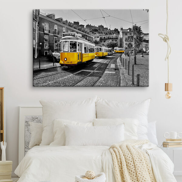 A yellow trolleys on a street