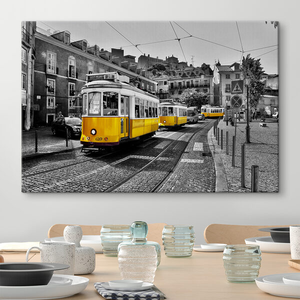 A yellow trolleys on a street