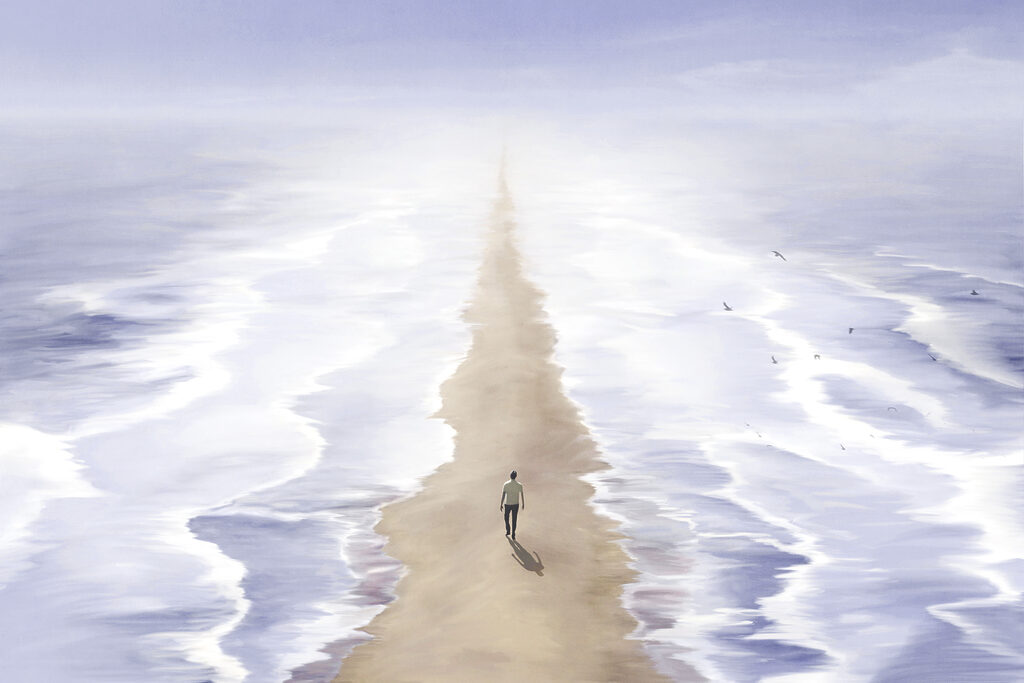 A person walking on a beach