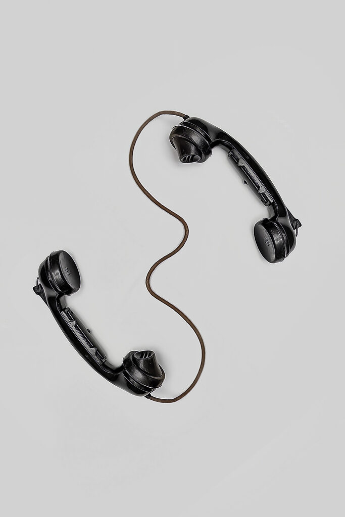 A pair of handsets with a cord