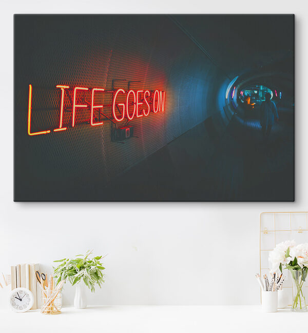 A neon sign in a tunnel